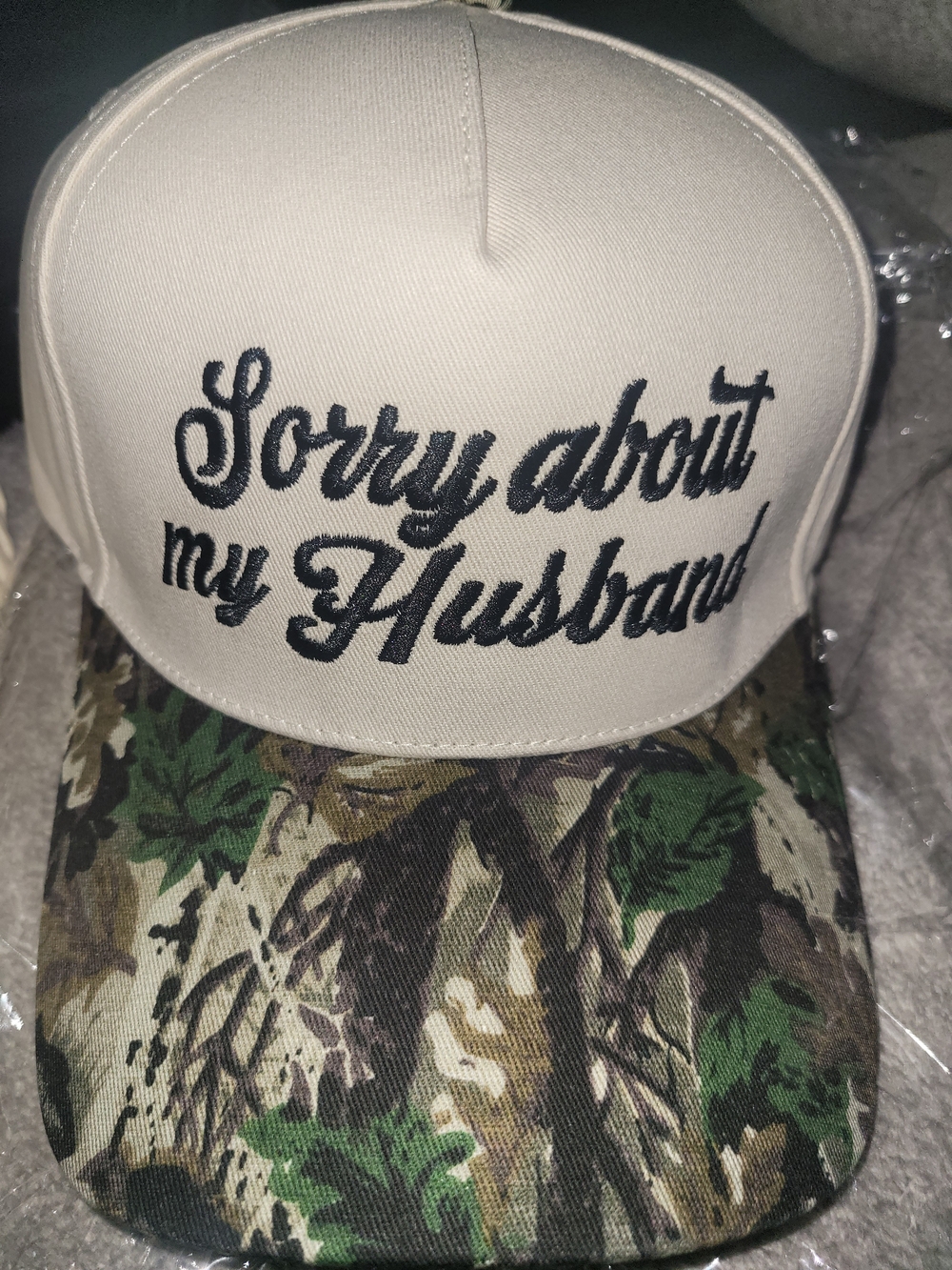 "Sorry About My Husband" Beige Trucker Hat with Camo Visor